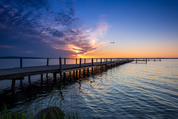 Fototapeta na wymiar Beautiful romantic sunset over a calm lake