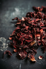 Red Hibiscus tea on the rustic background. Selective focus. Shallow depth of field.