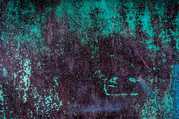 Texture of a rusty metal surface with white, green, salt, evergreen, dark blue, blue, aged cracked paint. Rusty and scratched painted metal wall