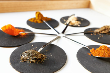 Cooking spices in spoons. Close-up with selective focus
