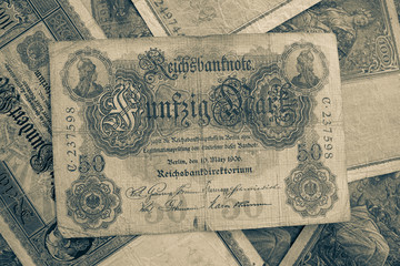 some old historical German banknotes lie spread out on a table