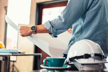 industry manager, engineer, businessman reading and checking blueprint, drawing  in the room. Engineer plan architecture concept.