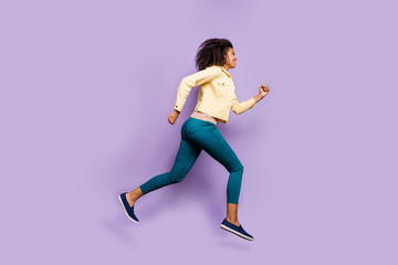 Fototapeta na wymiar Side profile full length body size photo of cheerful positive cute nice pretty girl running to shopping mall in pants trousers footwear isolated pastel violet color background