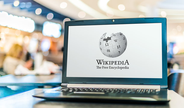 Laptop computer displaying logo of Wikipedia