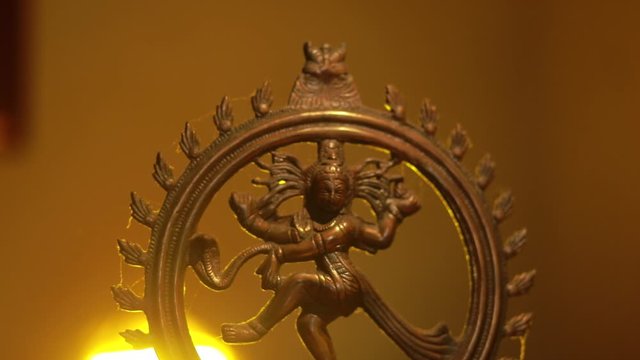 Traditional Indian statue of the dancing Shiva on the altar in the temple.
