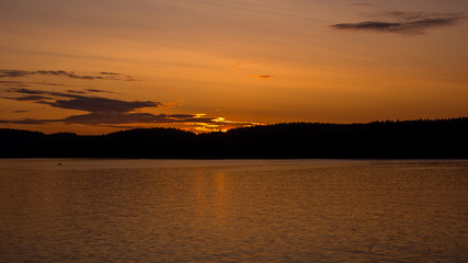 Evening sunset on the lake. - 345697919