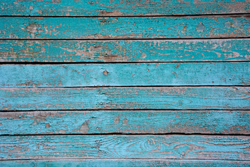 Fototapeta na wymiar Turquoise old wooden background with faded horizontal boards.