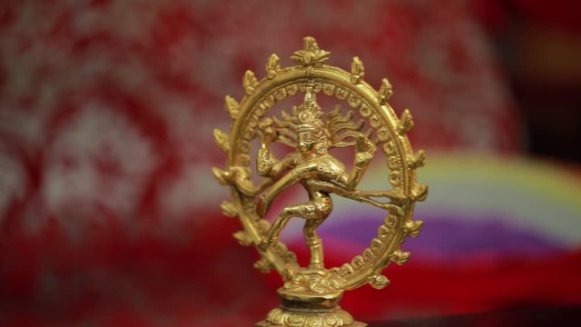 Traditional Indian statue of the dancing Shiva on the altar in the temple.