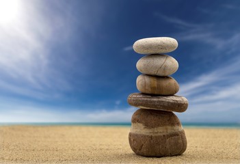 Fototapeta na wymiar Zen stones balanced on the beach