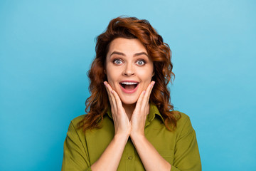 Portrait of content astonished woman touch hands face scream get incredible gift black friday...