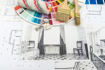 On office desk house sketch with color sample and brush.  Workplace Architect