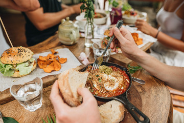 Friends having dinner in cafe.
