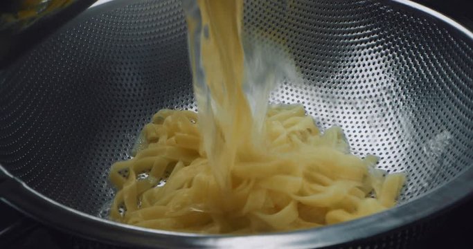 the pasta is moving to a colander