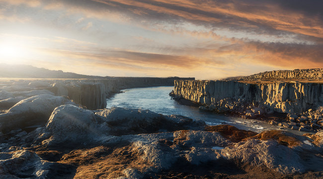 Scenic image nature of Iceland. Amazing tipical Icelandic scenery during sunset. The most beautiful conyon with black basalt columns  and river under sunligt in Iceland. Amazing nature landscape.