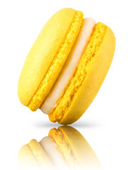 Macro photo of french yellow macaroon isolated on white background