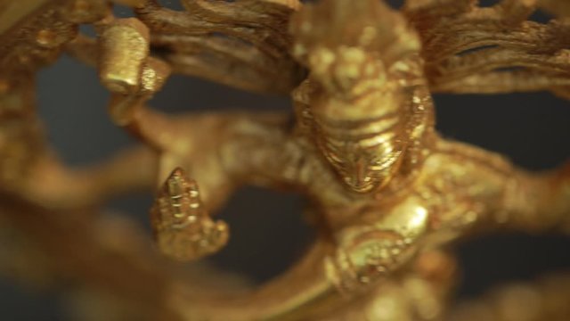 Traditional Indian statue of the dancing Shiva on the altar in the temple.