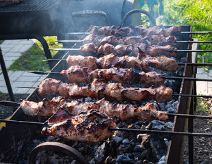 The meat is cooked in charcoal slices, kebab on the grill