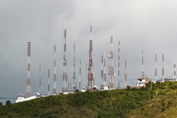 Communication transmitter towers on the mountain top in Cuenca, Ecuador