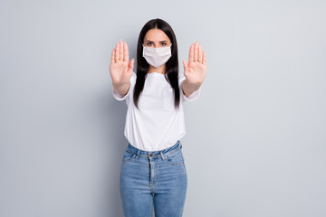 Portrait of nice attractive content serious straight-haired girl showing stop sign solution health...