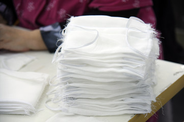 On the table are protective gauze bandages for the face.