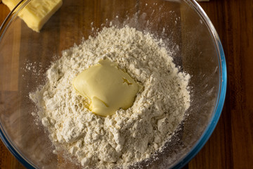 Flour, butter and pepper in a clear glass bowl