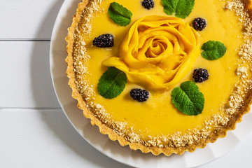Delicious traditional homemade pie shortcrust pastry close-up on the wooden table.