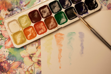 Watercolor paints with brush, watercolor brush strokes.