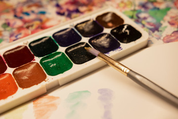 Watercolor paints with brush, watercolor brush strokes.