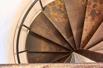 Metal spiral staircase in the old building