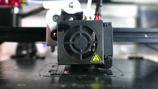 The 3D printer prints the model out of black plastic. Modern techology. 4K