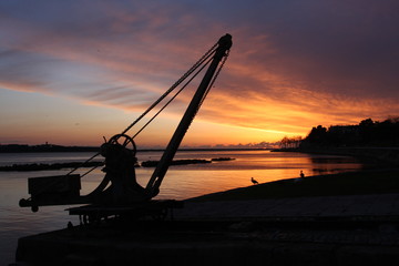 Sunset at the ocean, silhouettes, natural colors