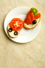 plate with sandwiches with different toppings on a light table.