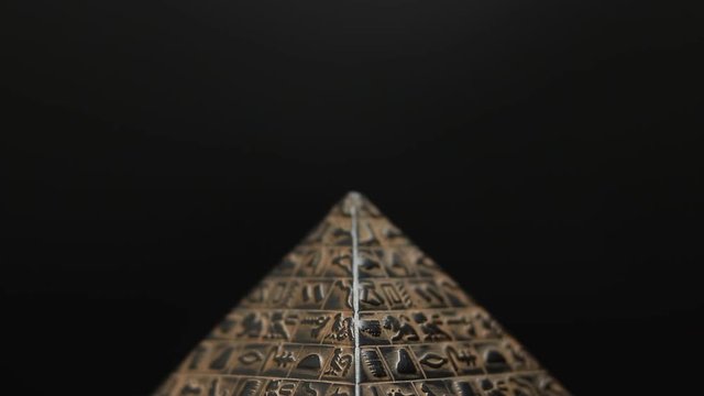 figurine pyramid. pyramid on a black background.