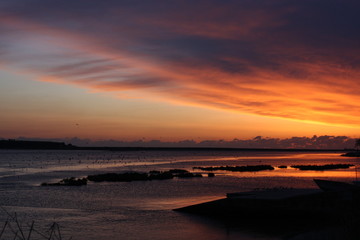 Sunset at the ocean, silhouettes, natural colors