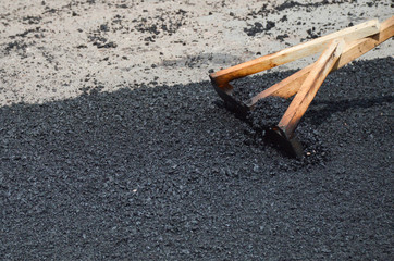wooden mop for leveling asphalt mix