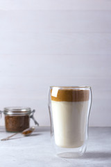 Homemade Dalgona coffee. A trendy drink with milk and whipped coffee with sugar and hot water.