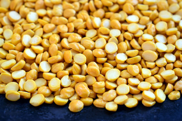 Chana Daal,Heap of yellow split chickpeas Indian raw food.