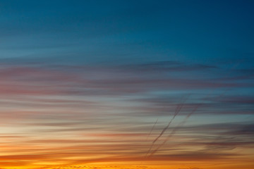 beautiful colored sky at dawn, and traces of the aircraft