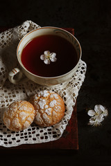 shortbread cookies and a cup of hot tea in a vintage cup. good morning. homemade baking. recipes