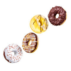 Set of flying glazed donuts with sprinkles on a white background