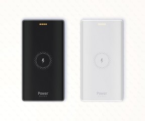 Black and grey wireless powerbanks isolated on white textured background.