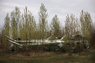 Fototapeta na wymiar destroyed military aircraft. equipment cemetery