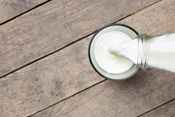 milk pouring into glass