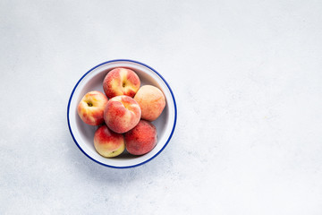 Healthy breakfast fruits and berry set on grey background. The concept of delicious and healthy food. Top view, copy space.