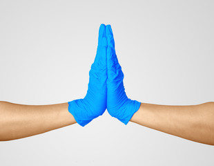 Hands in medic's nitrille blue glove.  Clap