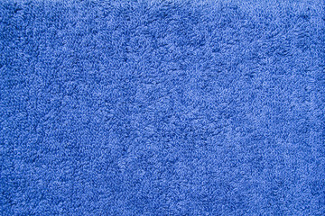 Closeup blue bath terry towel. Blue textile fabric texture background - obrazy, fototapety, plakaty
