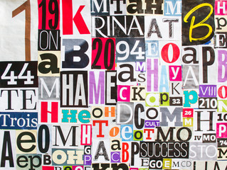 Bright colorful collage of magazine paper pieces and clippings with letters and numbers background.