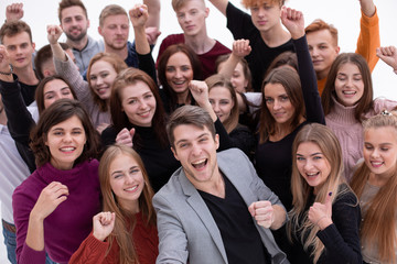 close up. happy young people showing their success