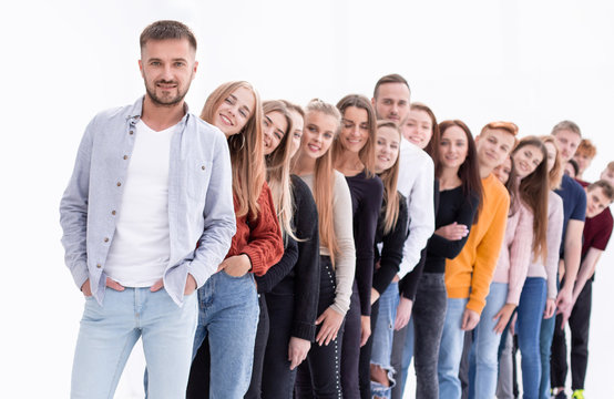 handsome guy standing in front of a group of young people