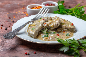 Beef liver in sour cream with parsley.